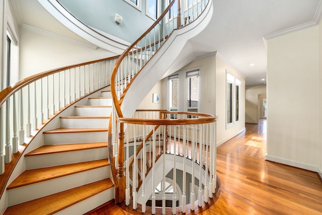 2217 Dunraven Ln, Houston, TX 77019 - stairway featuring wood finished floors, recessed lighting, and crown molding