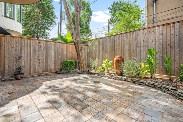 2217 Dunraven Ln, Houston, TX 77019 - fenced backyard featuring a patio
