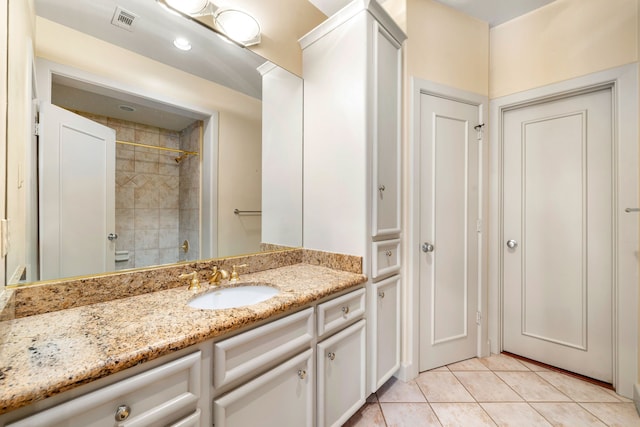 2217 Dunraven Ln, Houston, TX 77019 - full bathroom featuring vanity, tile patterned floors, and a shower