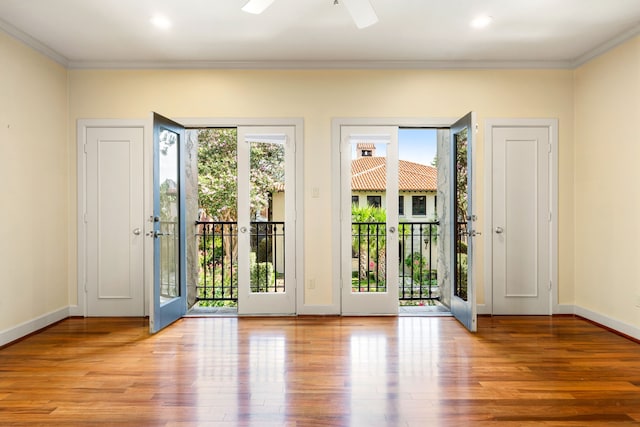 2217 Dunraven Ln, Houston, TX 77019 - foyer featuring plenty of natural light, ornamental molding, wood finished floors, a ceiling fan, and recessed lighting