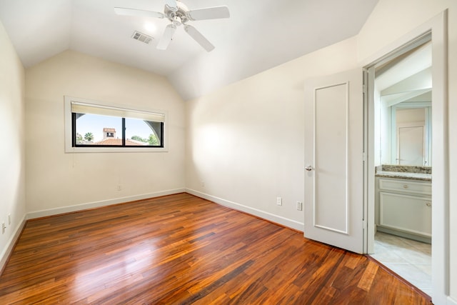 2217 Dunraven Ln, Houston, TX 77019 - unfurnished bedroom with wood finished floors, lofted ceiling, a ceiling fan, and ensuite bath