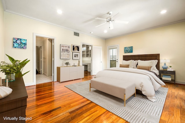 2217 Dunraven Ln, Houston, TX 77019 - bedroom with crown molding, wood finished floors, recessed lighting, and a ceiling fan