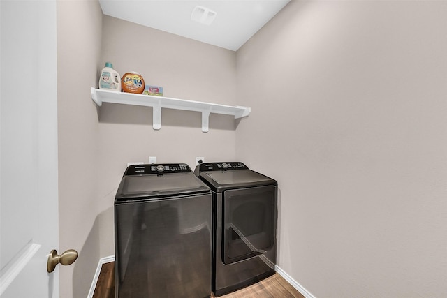 4310 Fornari Ln, Katy, TX 77449 - washroom with independent washer and dryer and wood finished floors