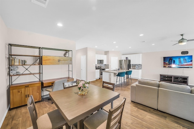 4310 Fornari Ln, Katy, TX 77449 - dining space with light wood-style flooring, a ceiling fan, and recessed lighting