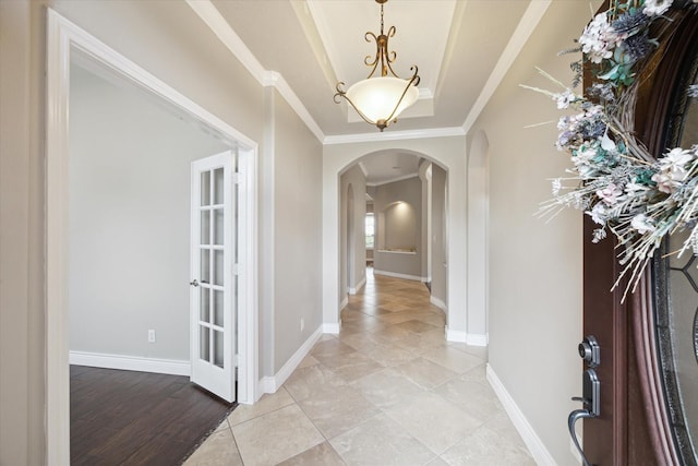 2508 Siskin Trl, League City, TX 77573 - entryway with arched walkways, ornamental molding, a raised ceiling, and light tile patterned flooring
