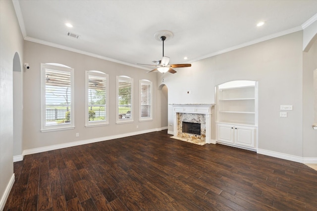 2508 Siskin Trl, League City, TX 77573 - unfurnished living room with ceiling fan, a high end fireplace, dark wood-style floors, crown molding, and recessed lighting