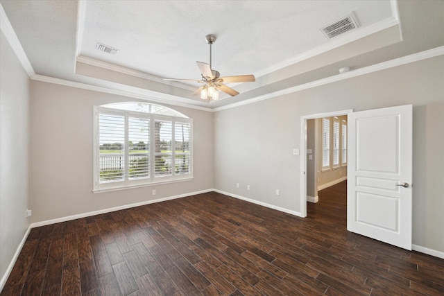 2508 Siskin Trl, League City, TX 77573 - empty room with a tray ceiling, a ceiling fan, dark wood-style floors, and ornamental molding