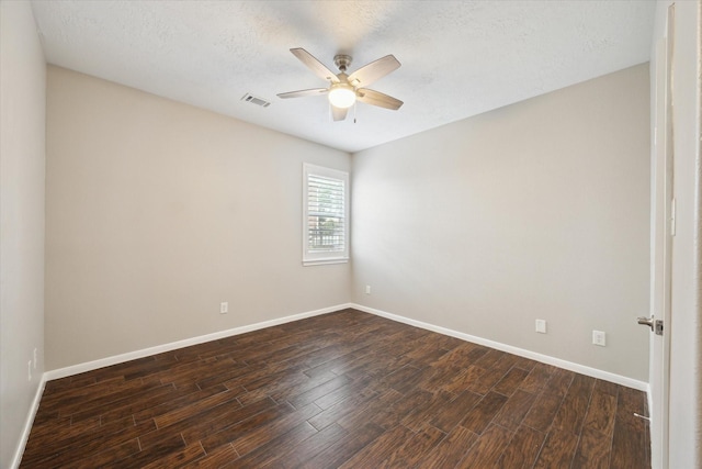 2508 Siskin Trl, League City, TX 77573 - unfurnished room with a ceiling fan, dark wood-style floors, and a textured ceiling