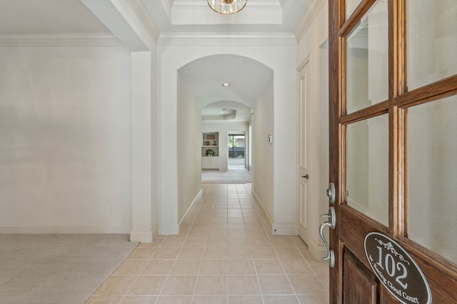 102 W Racing Cloud Ct, The Woodlands, TX 77381 - hallway with arched walkways, light tile patterned flooring, crown molding, and recessed lighting