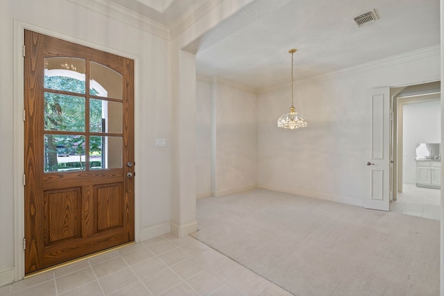 102 W Racing Cloud Ct, The Woodlands, TX 77381 - entrance foyer featuring light carpet, light tile patterned floors, crown molding, and a chandelier