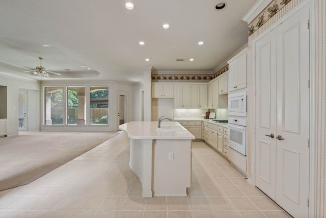 102 W Racing Cloud Ct, The Woodlands, TX 77381 - kitchen with white appliances, recessed lighting, open floor plan, ornamental molding, and a ceiling fan