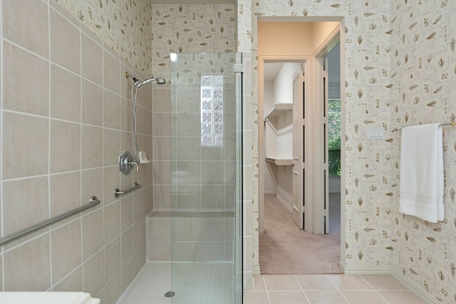 102 W Racing Cloud Ct, The Woodlands, TX 77381 - bathroom with wallpapered walls, a shower stall, and tile patterned flooring