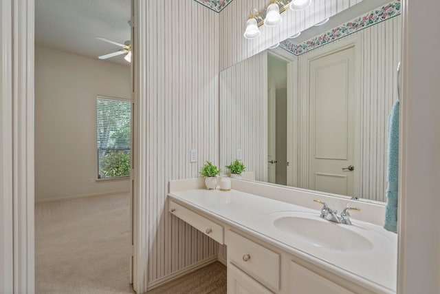 102 W Racing Cloud Ct, The Woodlands, TX 77381 - bathroom with a ceiling fan, vanity, and wallpapered walls