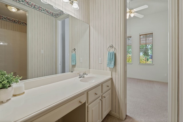 102 W Racing Cloud Ct, The Woodlands, TX 77381 - bathroom featuring wallpapered walls, vanity, and a ceiling fan