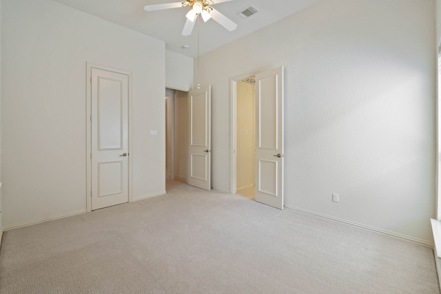 102 W Racing Cloud Ct, The Woodlands, TX 77381 - unfurnished bedroom featuring light colored carpet and ceiling fan
