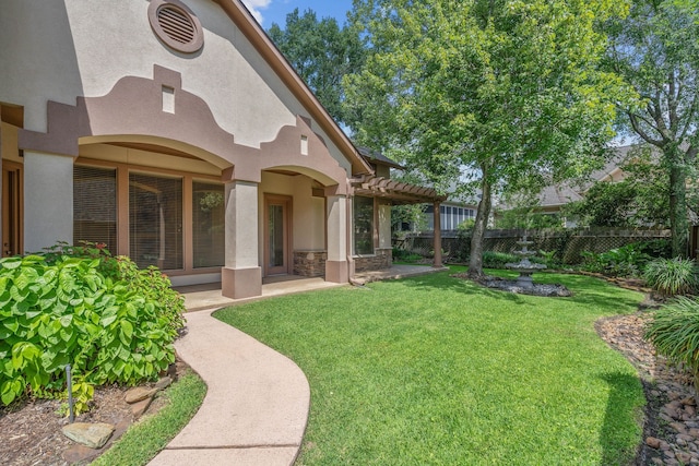 102 W Racing Cloud Ct, The Woodlands, TX 77381 - back of house featuring stucco siding, stone siding, and a patio area