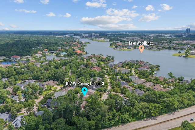 102 W Racing Cloud Ct, The Woodlands, TX 77381 - aerial view of property's location featuring a large body of water and nearby suburban area
