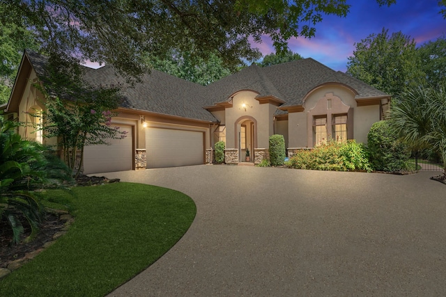 102 W Racing Cloud Ct, The Woodlands, TX 77381 - french provincial home featuring driveway, a garage, stucco siding, stone siding, and a shingled roof