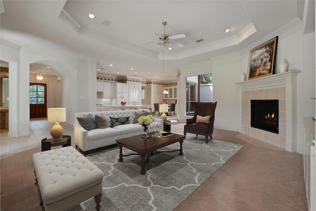 102 W Racing Cloud Ct, The Woodlands, TX 77381 - living area featuring ceiling fan, crown molding, arched walkways, recessed lighting, and light colored carpet