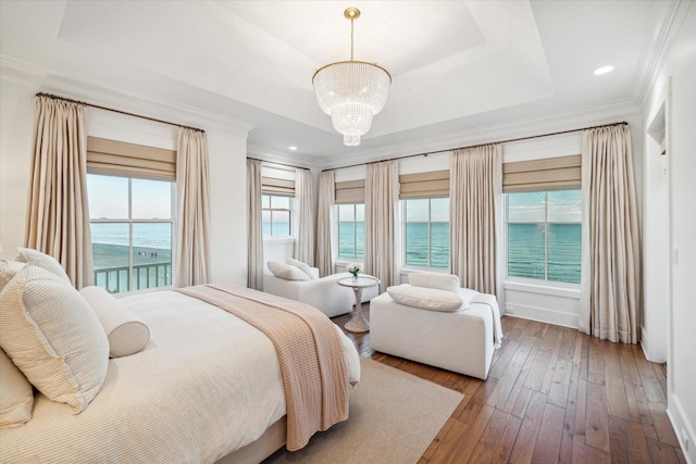 4223 Swashbuckle, Galveston, TX 77554 - bedroom with ornamental molding, hardwood / wood-style flooring, a chandelier, a water view, and recessed lighting