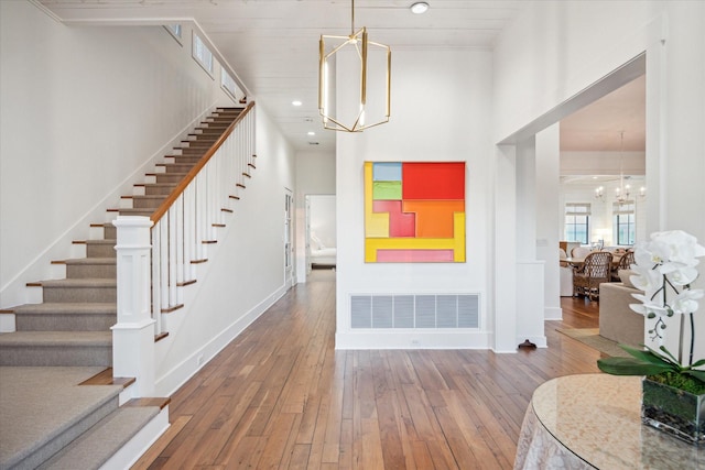 4223 Swashbuckle, Galveston, TX 77554 - entrance foyer with a chandelier, hardwood / wood-style flooring, stairway, and recessed lighting