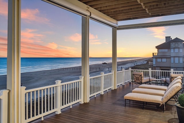 4223 Swashbuckle, Galveston, TX 77554 - deck at dusk featuring view of water and beach
