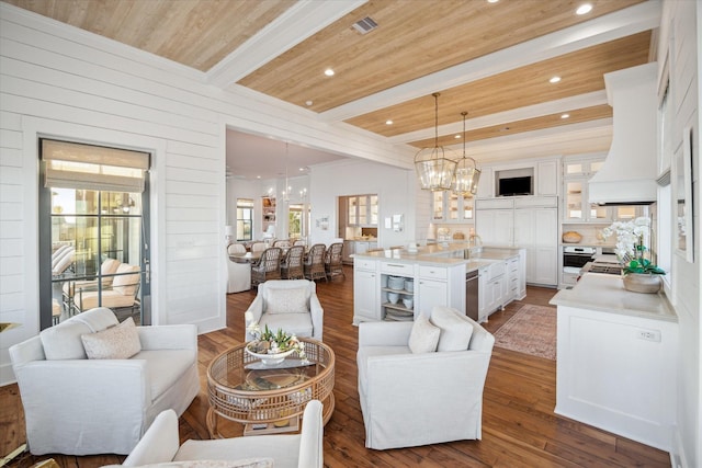 4223 Swashbuckle, Galveston, TX 77554 - living area with a chandelier, beam ceiling, dark wood finished floors, healthy amount of natural light, and recessed lighting