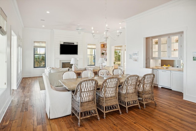 4223 Swashbuckle, Galveston, TX 77554 - dining space featuring ornamental molding, hardwood / wood-style flooring, ceiling fan, recessed lighting, and a chandelier