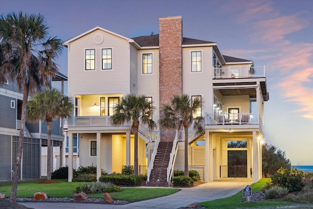 4223 Swashbuckle, Galveston, TX 77554 - coastal home with a chimney and a balcony