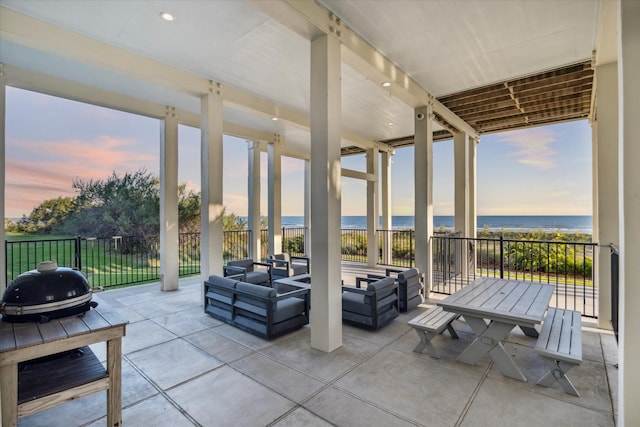 4223 Swashbuckle, Galveston, TX 77554 - patio terrace at dusk with a water view, outdoor lounge area, and a patio area
