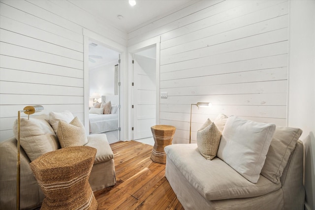 4223 Swashbuckle, Galveston, TX 77554 - living area with wood-type flooring and wooden walls
