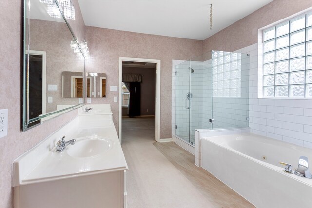 402 Starleaf Ln, Pearland, TX 77584 - bathroom with a stall shower, a jetted tub, and double vanity