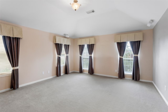 402 Starleaf Ln, Pearland, TX 77584 - empty room featuring plenty of natural light, light carpet, and lofted ceiling