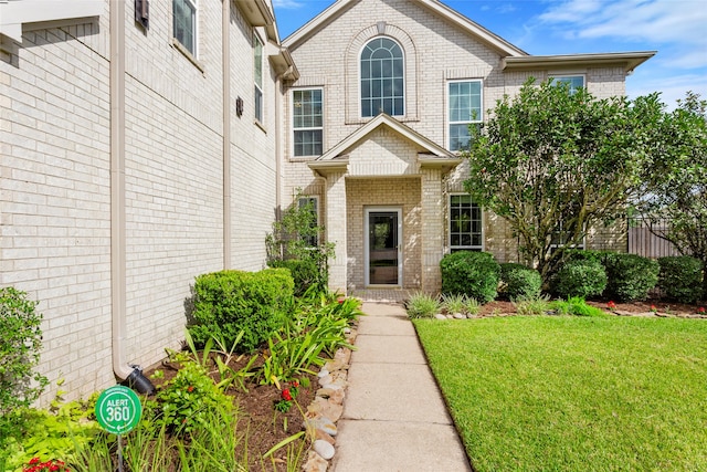 402 Starleaf Ln, Pearland, TX 77584 - view of front facade with brick siding and a front lawn