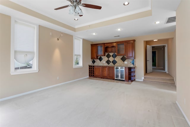 402 Starleaf Ln, Pearland, TX 77584 - unfurnished living room with light colored carpet, crown molding, recessed lighting, wine cooler, and a ceiling fan