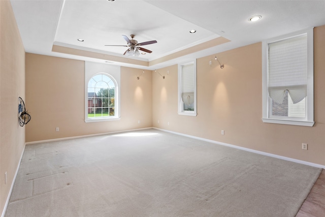 402 Starleaf Ln, Pearland, TX 77584 - carpeted spare room with a tray ceiling, ceiling fan, and recessed lighting