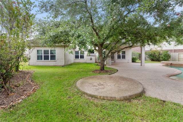 402 Starleaf Ln, Pearland, TX 77584 - rear view of house featuring brick siding and a patio