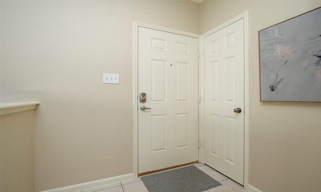 6607 Lake Woodlands Dr Unit 223, The Woodlands, TX 77382 - doorway featuring baseboards and light tile patterned floors