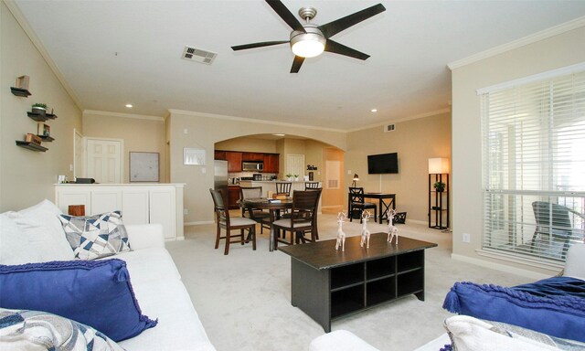 6607 Lake Woodlands Dr Unit 223, The Woodlands, TX 77382 - living area featuring arched walkways, a ceiling fan, crown molding, light colored carpet, and recessed lighting