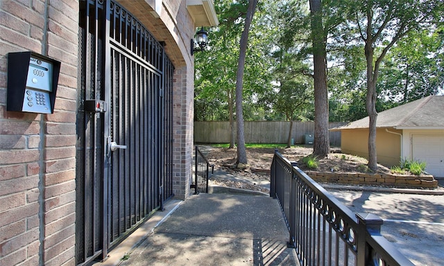 6607 Lake Woodlands Dr Unit 223, The Woodlands, TX 77382 - view of patio / terrace featuring a garage