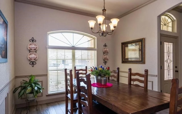 2977 Presidio Cir, Belton, TX 76513 - dining room with a chandelier, ornamental molding, wood finished floors, and arched walkways