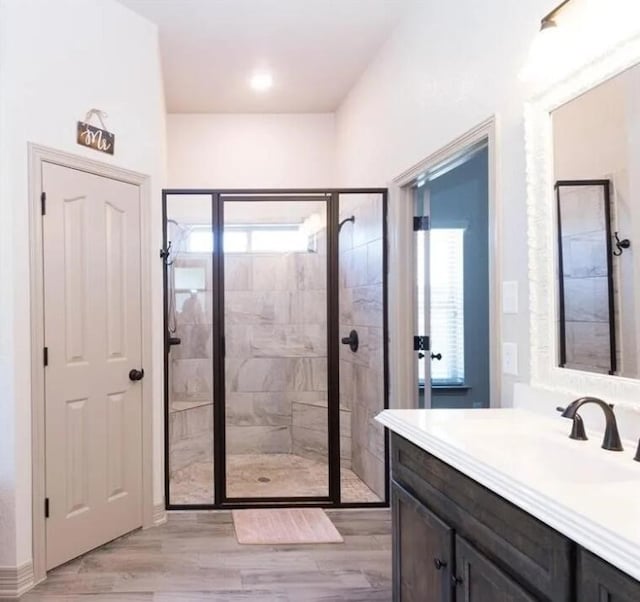 2977 Presidio Cir, Belton, TX 76513 - bathroom featuring healthy amount of natural light, a shower stall, vanity, and wood finished floors