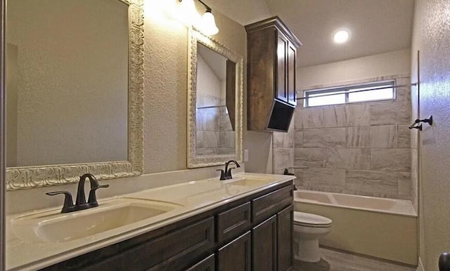 2977 Presidio Cir, Belton, TX 76513 - full bathroom featuring double vanity, shower / washtub combination, wood finished floors, and a textured wall