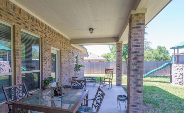 2977 Presidio Cir, Belton, TX 76513 - fenced backyard featuring a playground, a patio, and outdoor dining area