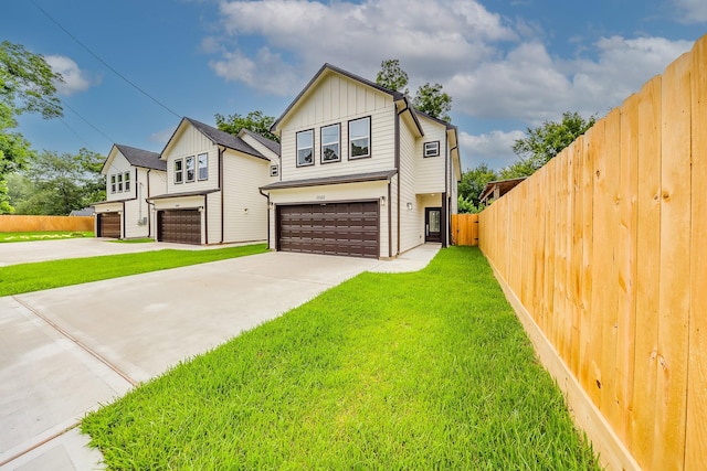 10512 Exeter St, Houston, TX 77093 - view of front of property featuring board and batten siding, a garage, and concrete driveway