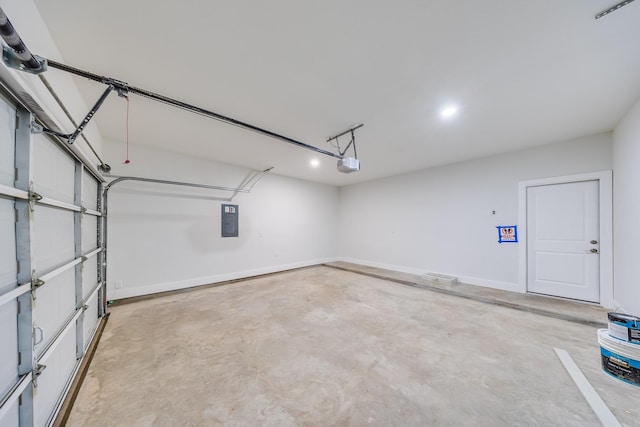 10512 Exeter St, Houston, TX 77093 - garage featuring electric panel, a garage door opener, and recessed lighting