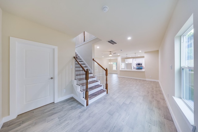 10512 Exeter St, Houston, TX 77093 - stairway with wood finished floors, recessed lighting, and ceiling fan
