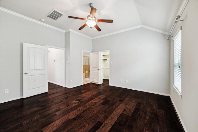 31703 Morning Ridge Ln, Spring, TX 77386 - unfurnished bedroom with wood finished floors, crown molding, a walk in closet, connected bathroom, and vaulted ceiling