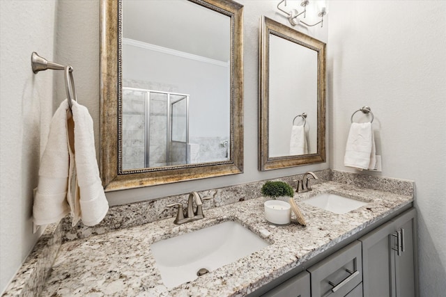31703 Morning Ridge Ln, Spring, TX 77386 - full bathroom with crown molding, double vanity, and a stall shower