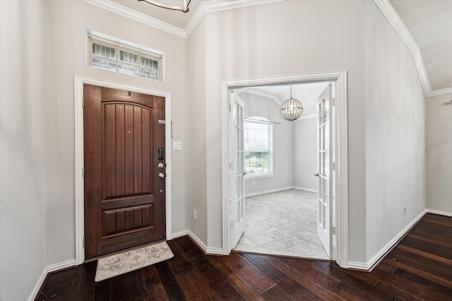 31703 Morning Ridge Ln, Spring, TX 77386 - foyer with ornamental molding, a chandelier, and wood-type flooring